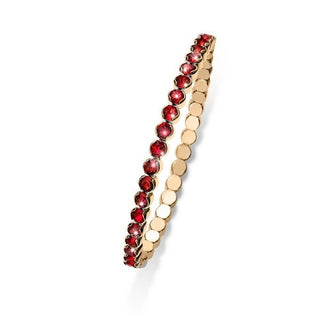 Bracciale elastico. Color oro con cristalli rossi