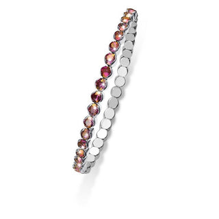 Bracciale elastico. Metallo rodiato con cristalli magenta/oro