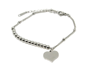Pulsera de mujer con eslabones de cadena y puntos y corazón